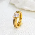 Macro view of gold-plated double-layer ring with sparkling rectangular center stone - US 7 / Square Stone Double Loop / Gold