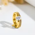 Close-up of golden double-layer stainless steel ring with elegant oval cubic zirconia - US 7 / Oval Stone Double Loop / Gold