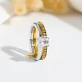 Close-up of double-layered stainless steel ring featuring an oval crystal and pavé stones. - US 7 / Oval Stone Double Loop / Gold & Silver Gradient