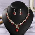 Vintage gold-tone bridal jewelry set with red crystal drops on a black display stand - All-match Premium Red (NS-J6597GHRED)