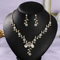 Vintage Southeast Asian style bridal necklace and earring jewelry set with floral crystal details - Photo Party Gold (NS-J6586G)