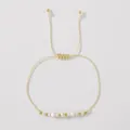 Handmade adjustable cream woven bracelet with natural stones and gold-tone beads - Beige