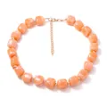 Detailed close-up showing the orange resin cube beads with realistic marble texture on a necklace - Lotus Pink