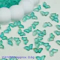 Macro view of 15x10mm transparent turquoise butterfly beads for DIY jewelry making crafts - 15x10mm / Light Blue