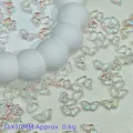 Detail macro view of iridescent butterfly beads for DIY jewelry making accessories. - 15x10mm / Iridescent White