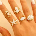 Anelli regolabili in acciaio inox dorato con animali marini e smalto bianco lucido - Set Serie Biologica Oceano Bianco