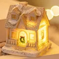 Cozy warm white LED glowing resin Christmas house miniature ornament with snow details - Style C