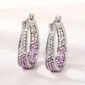 Close-up of silver-toned U-shaped hoop earrings with clear and purple crystal pavé - Light Purple Gradient