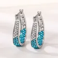 Close-up detail of U-shaped silver hoop earrings featuring blue and white gradient pavé crystals - Blue White Gradient