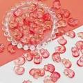Detailed macro view of 18x13mm red and gold glass fox beads for DIY jewelry making - Bright Red Fox