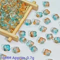 Close-up view of 10mm blue and orange gradient glass flower beads for DIY crafts. - Dawn (L346#)