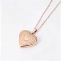 Close-up detail of a rose gold heart locket necklace with intricate floral pattern - Floral Heart Locket Pendant (Rose Gold)
