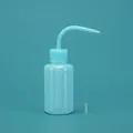 Light blue plastic squeeze wash bottle with curved nozzle and clear scale markings for lab use - 150ml (with Stopper) / Blue