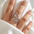 Elegant silver-toned stainless steel open ring featuring a delicate double hollow flower design - Steel-Double Hollow Flower Style(2585)
