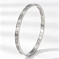 Elegant titanium steel bangle with hollow Great Wall pattern in silver finish - Check Pattern / Silver