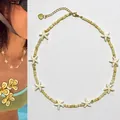 Détail du collier de perles avec étoiles de mer et chaîne d'extension dorée - Collier Étoile de Mer Beige avec Entretoises