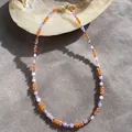 Detail view of natural stone beaded necklace with orange and purple beads - Necklace 12 (38+5cm)