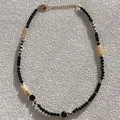 Detailed view of handmade natural stone beaded necklace with black and dalmatian beads - Necklace 16 (38+5cm)