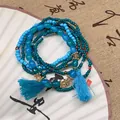 Juego de seis pulseras de cuentas azules de estilo étnico con borlas celestes y dijes - Pulsera Nº 5 - Azul (conjunto De 6 Piezas)