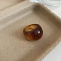 Amber-colored translucent resin ring with a chunky geometric oval design - 22# Amber