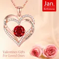 Rose gold heart pendant necklace with red January birthstone and zircon accents. - Single Necklace / Red Zircon