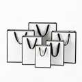 Sacchetti regalo in carta bianca di varie dimensioni con bordi neri - 27cmx8cmx21cm (Orizzontale) / Bianco Bordo Nero