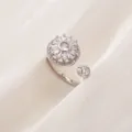 Elegant rotating flower ring with sparkling micro-pave cubic zirconia in silver finish - Adjustable Open Size / Exquisite Round Flower Style (A012) / Silver