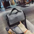 Fashionable studded motor-style handbag with matte gray and black finish details - Gray