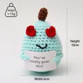 Adorable handmade blue crochet avocado plush toy holding a positive guac message card - Avocado