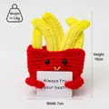 Handmade crochet french fries doll holding a positive Always Fry Your Best quote card - French Fries
