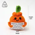 Handmade crochet positive orange doll holding a tiny encouraging message card for gifts - Orange
