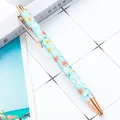 Floral retractable ballpoint pen in light blue with rose gold accents for students - 1.0mm Bullet Tip / Style C Big Flower Blue