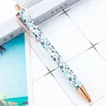 Floral pattern ballpoint pen with elegant rose gold metal accents and retractable design. - 1.0mm Bullet Tip / Style D Small Flower White