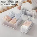 Detalle del juego de 3 organizadores de malla beige para sujetadores y calcetines - Set de tres piezas / Tamaños Mixtos / Blanco