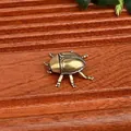 Close-up detail of antique solid brass beetle figurine for home and desk decoration - Ladybug