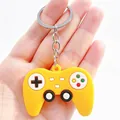 Detail view of a creative yellow silicone game controller keychain with metal ring. - Simulation Gamepad / Yellow