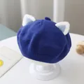 Detailed view of a cute blue knitted baby beret featuring soft white fuzzy animal ears - One Size 46-51cm / Blue