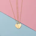 Close-up of gold-plated broken heart pendant necklace set for couples in titanium steel - Gold Set