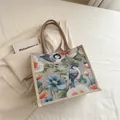 Große Baumwoll-Leinen-Einkaufstasche mit einem künstlerischen Blumen- und Vogelprint - Eleganter Blauer Blumen-Vogeldruck