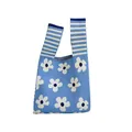 Close-up detail of a blue knitted tote bag with white floral pattern and striped handles - Flower Blue