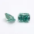 Macro detail of a radiant cut teal moissanite gemstone showing brilliant facets - Cyan