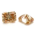 Detail view of radiant cut Fanta orange moissanite stones showing facet brilliance - Champagne