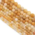 Macro view of natural old yellow jade beads in various sizes for DIY jewelry making - Diameter 6mm / Approx 60 Pieces/Pack / Yellow Aventurine (Old Yellow Jade)