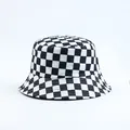 Detailed view of a classic black and white checkered checkerboard bucket hat for women - Reversible (3) / Black & White Checkerboard
