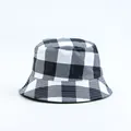 Front view of a classic black and white checkered bucket hat for outdoor leisure. - Black and White Large Plaid