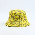 Close-up of a yellow bucket hat featuring an all-over cartoon rubber duck print - Yellow Duck