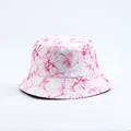Close-up detail of white bucket hat featuring a vibrant pink floral pattern print - Pink Floral