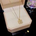 Élégant collier à pendentif trèfle à quatre feuilles doré avec pierres de zircone - Acier Titane X640 Véritable Conservation De La Couleur Or