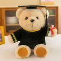 Adorable plush teddy bear wearing black graduation gown and mortarboard with scroll - Sitting Graduation Bear - Yellow Collar / 25cm