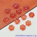 Close-up of 14mm orange sunflower glass beads for DIY jewelry making projects and crafts - Red